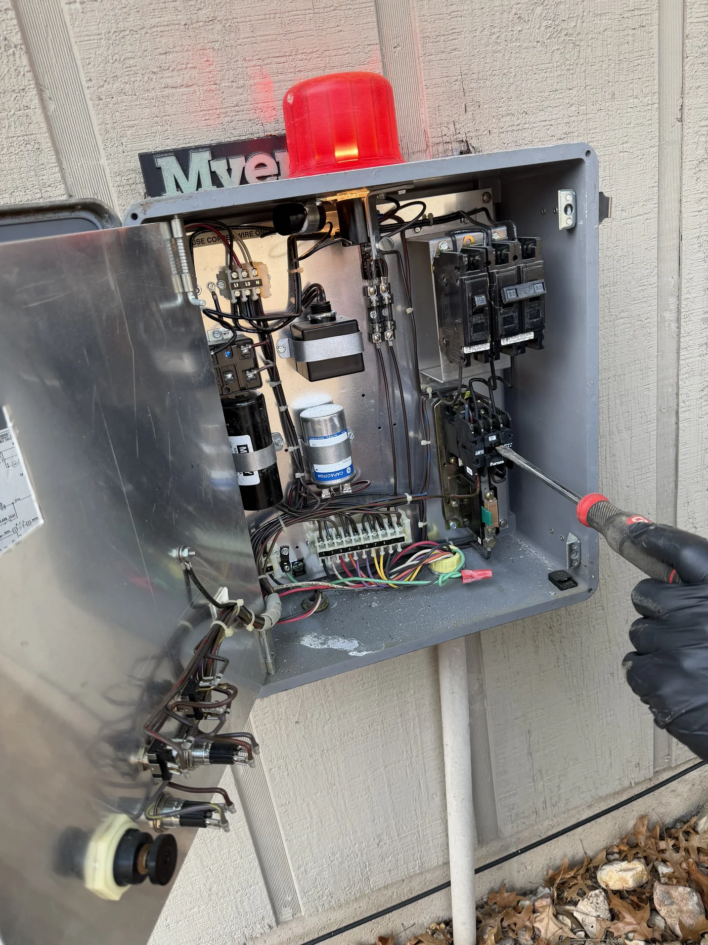 Open septic pump control panel with alarm light