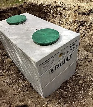 Septic tank with two green access lids